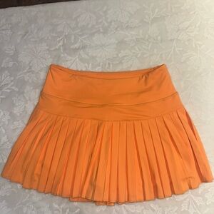 Gold Hinge 
Vibrant Orange Pleated Skort
